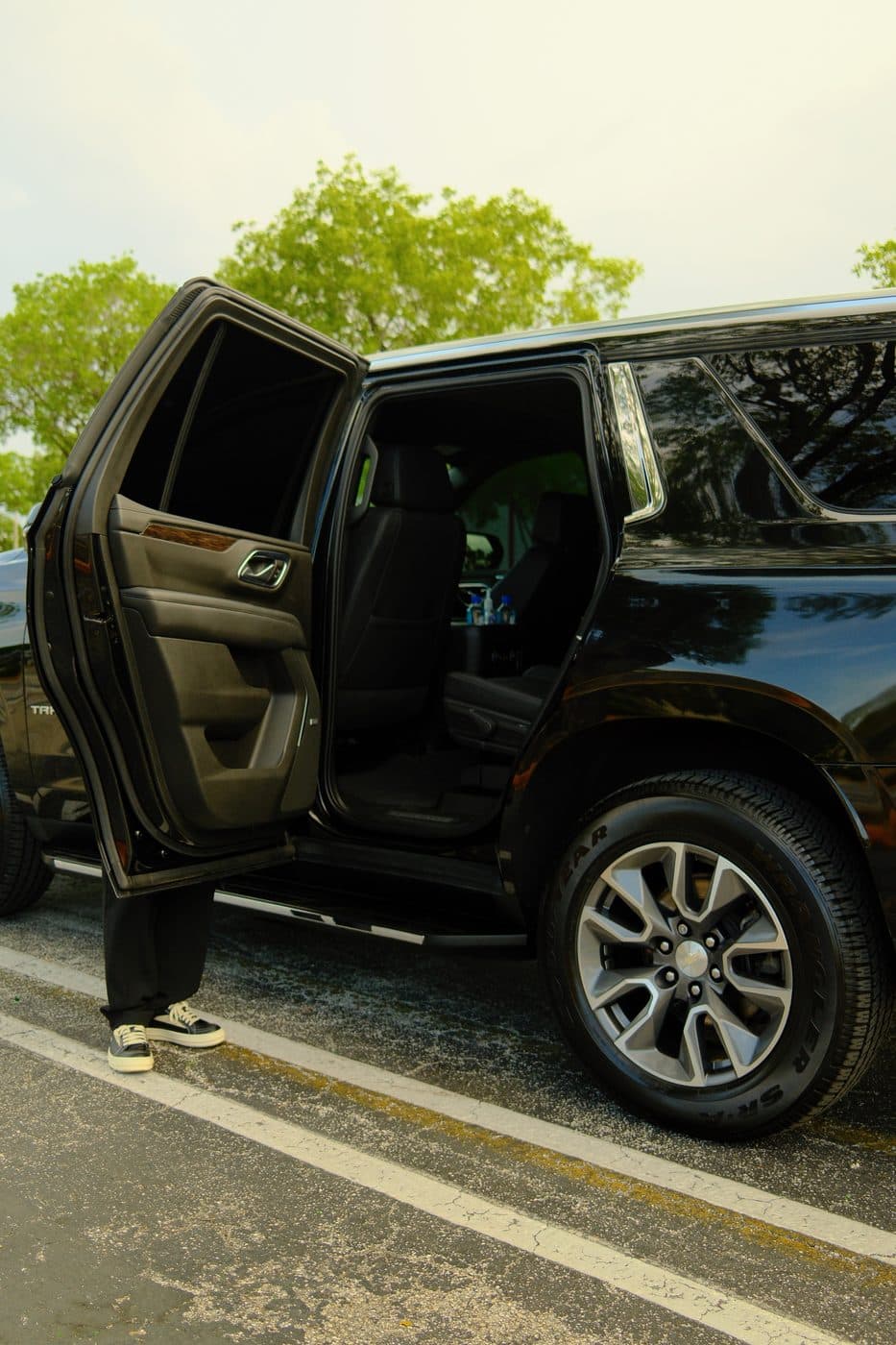 Black Ice full-size SUV with rear passenger door open